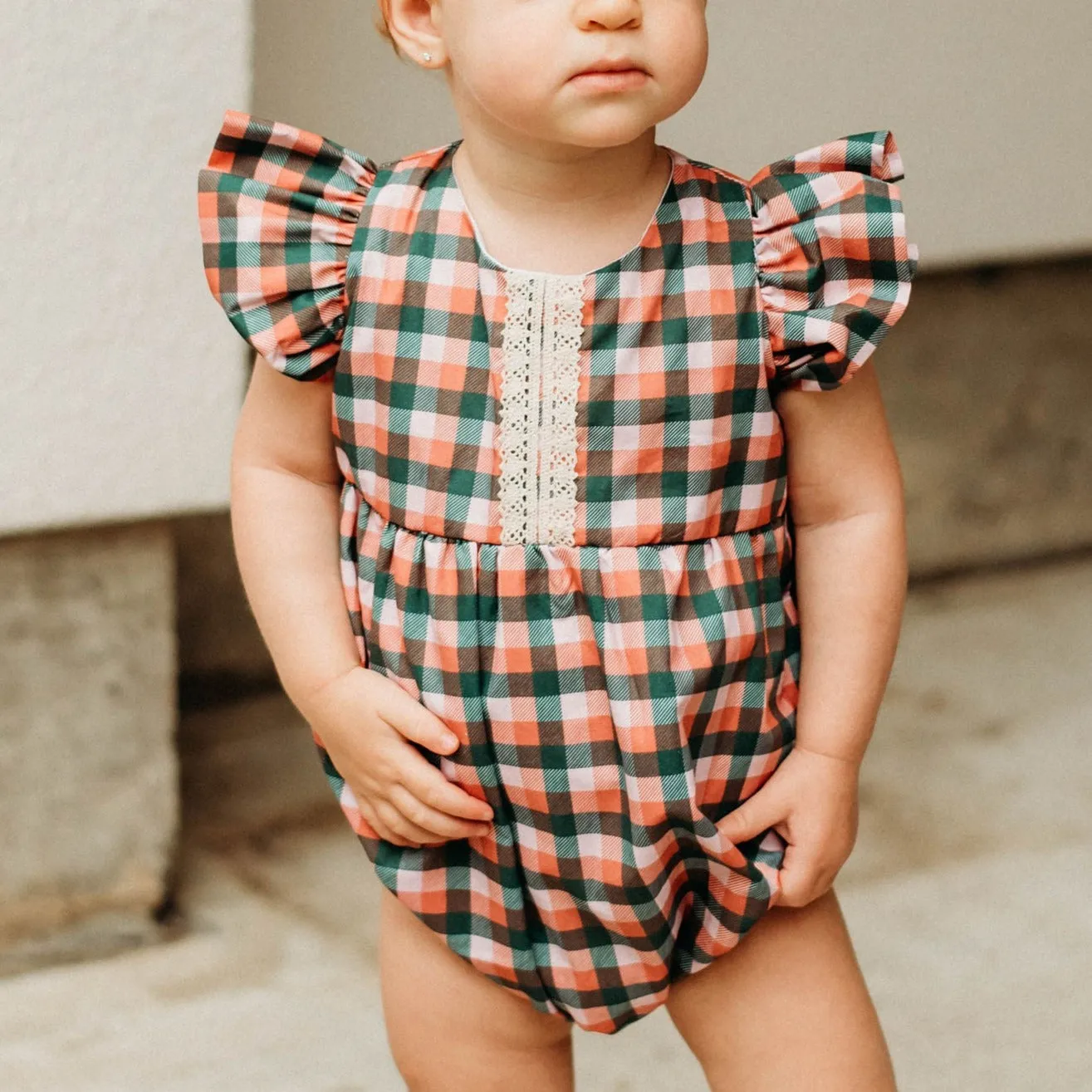 Infant Girl's Muted Red and Green Plaid Christmas Bubble Romper with Ivory Trim